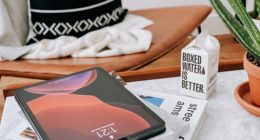 black and white book on white textile